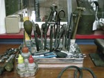 Everybody has a mess on their bench that has all those small items that seem to get lost. So, I built a small tin box that has a tray for all the pencils and misc. I then added a raised set of squares to place all my different plyiars, and a separate set of squares that contain my scissers/rulers/small hammers/files/screw drivers and etc. It really keeps my small items in one place and is easy to access. In the same picture, I built a round item that contains my liquid flux, flux remover and a plastic bottle with a long spout to dispense the flux. 