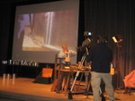 Ready for closeup on stage in Wallace Gallery during presentation.